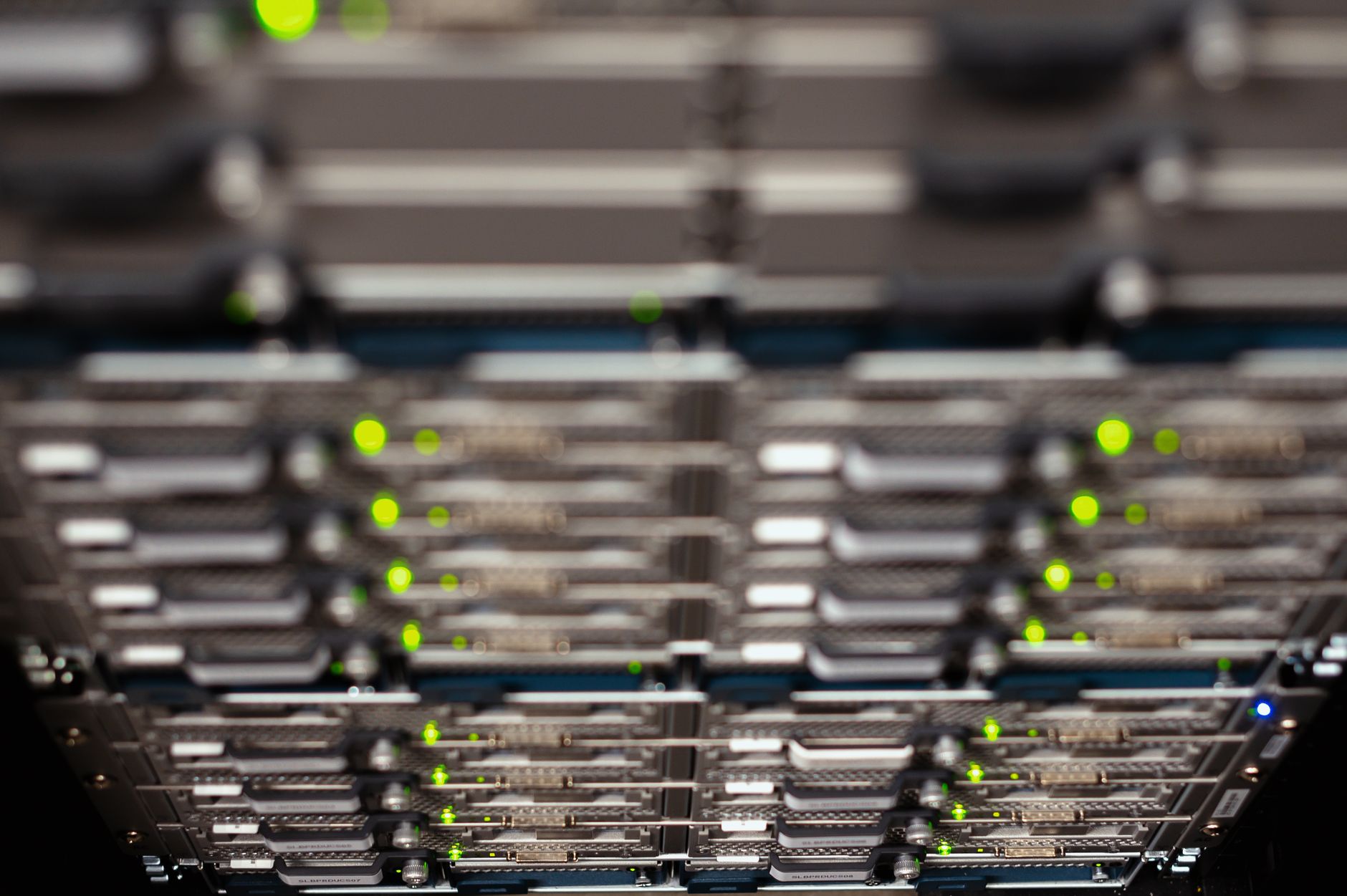 A server array illuminated inside a secure server warehouse